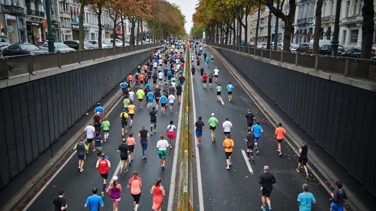 runners on a city road