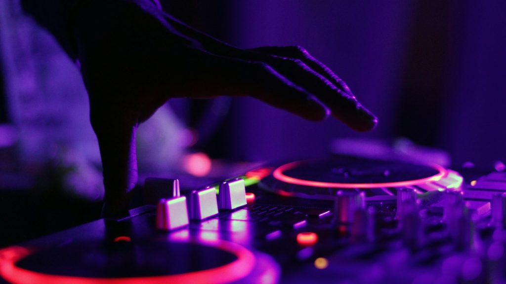 silhouette of a DJ at the decks
