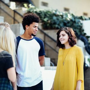 two people talking across a table