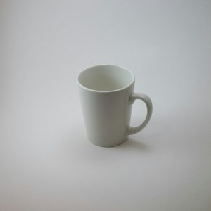 a plain white mug on a white table