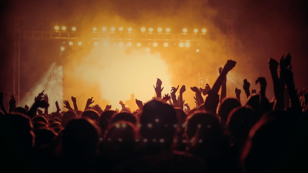 band performing on stage in front of a crowd