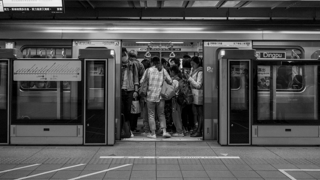 people waiting in a subway